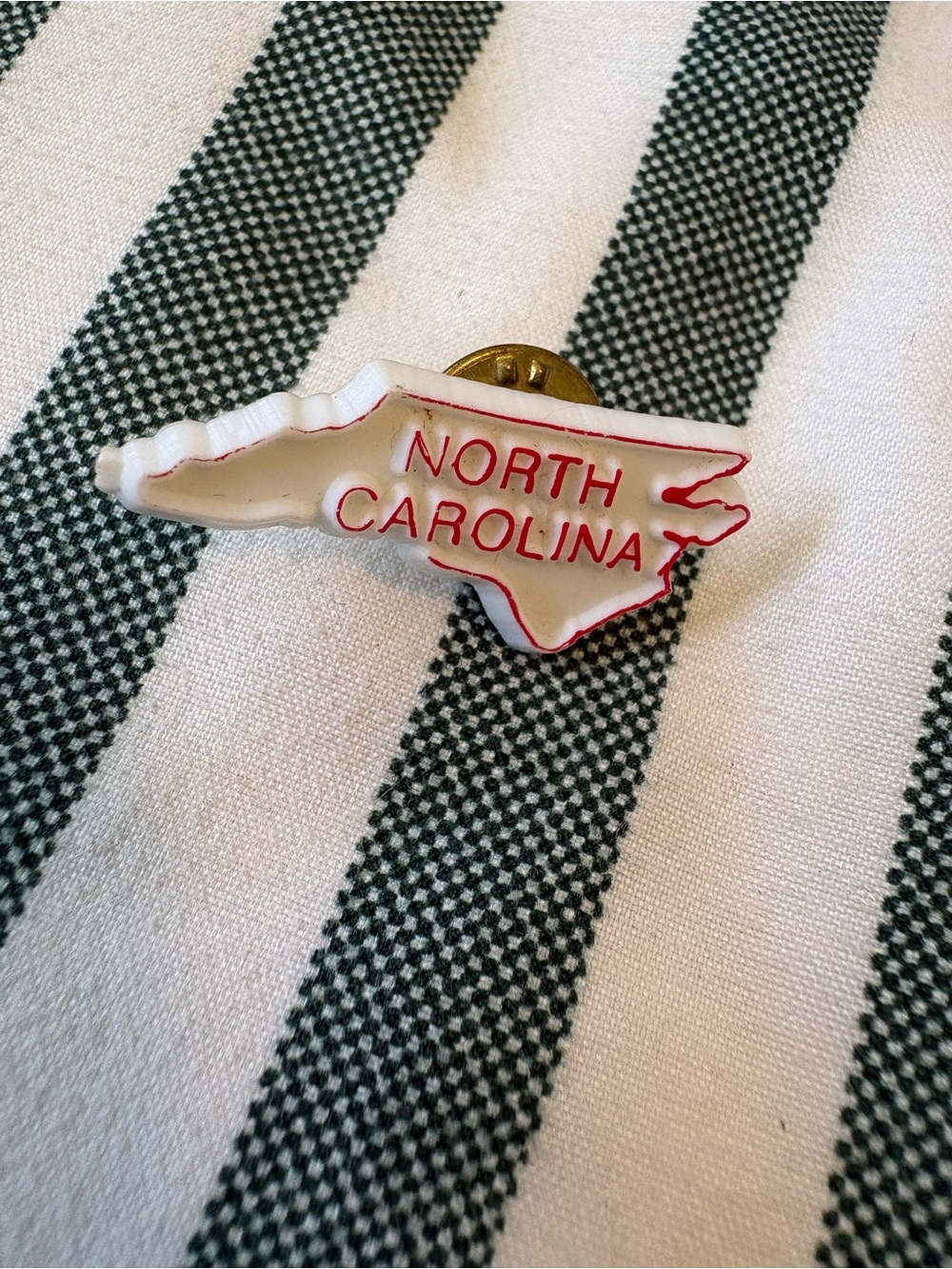 American Vintage White North Carolina State Pin with Red Lettering